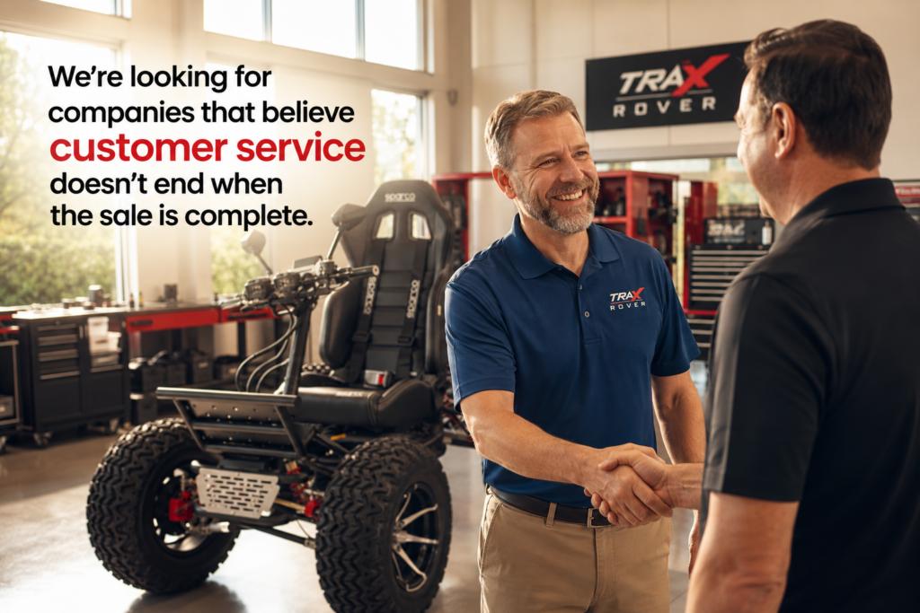 Trax Rover Dealer Shop shaking hands with customer